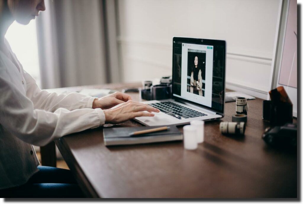 a woman works at a computer