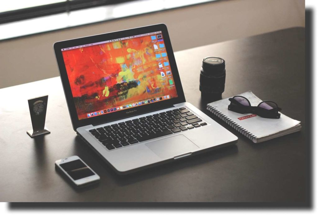 mac book on top of the table