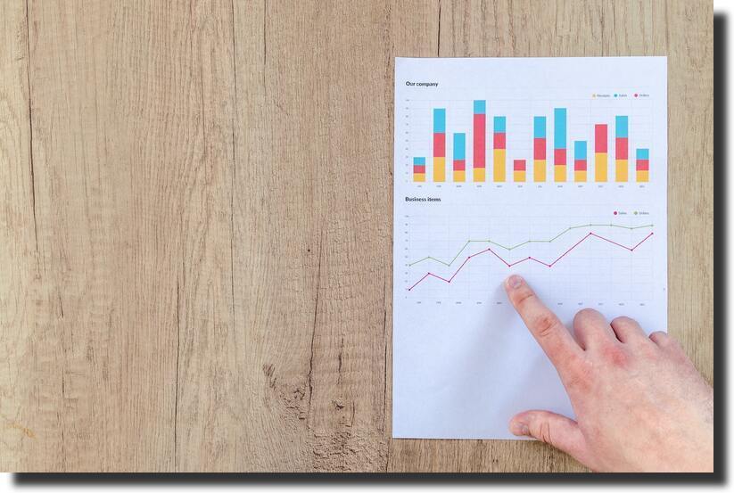 person-pointing-paper-line-graph